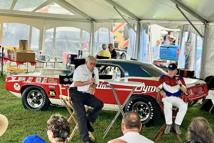 Drag racer Herb McCandless and Buddy Martin (right) regale fans with tales from drag racing’s golden era in front of a legit Sox & Martin ’Cuda. (Photo by David Hakim)